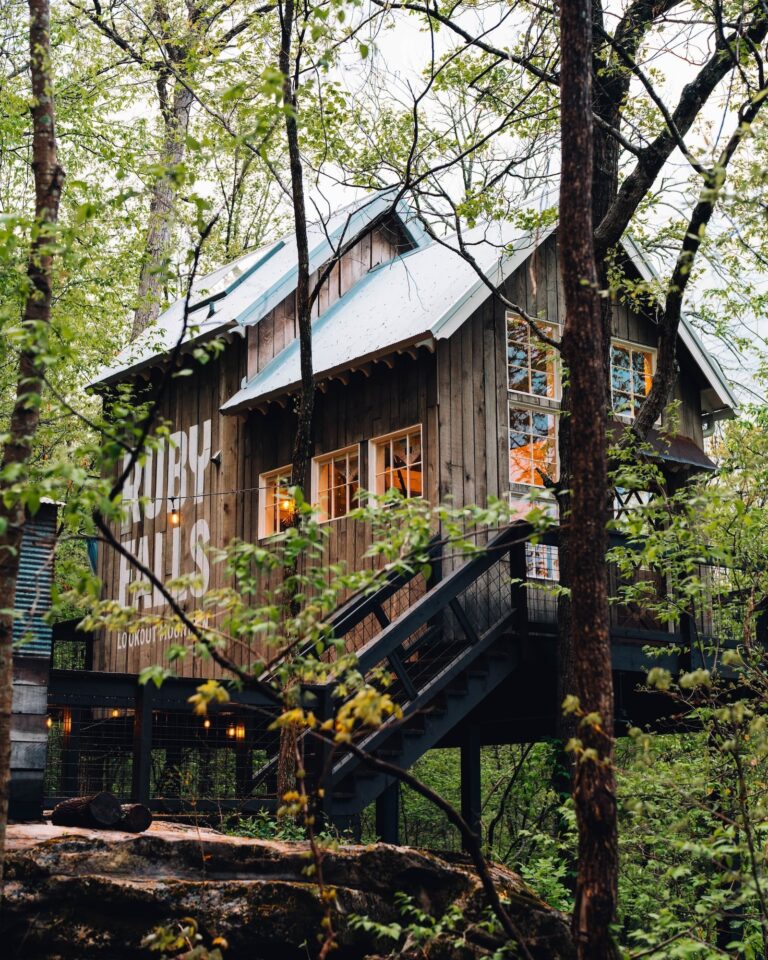 A treehouse in the words with the words Ruby Falls on the side